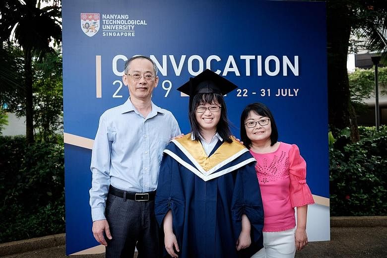 Miss Felicia Lim with her parents, Mr Lim Bon Kee and Madam Noreen Chia, at her graduation ceremony in Nanyang Technological University on Tuesday.