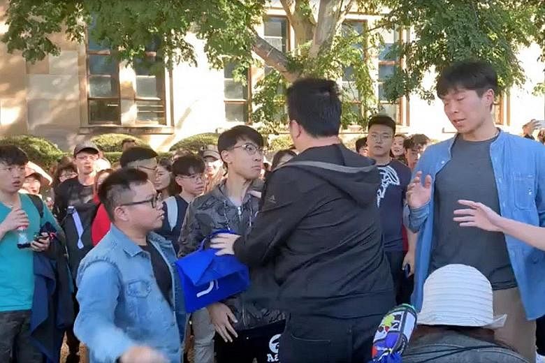 A screengrab from a video posted on social media shows students at The University of Queensland clashing at an event organised by Hong Kong international students to support the pro-democracy protests in Hong Kong. Organisers alleged that pro-China s