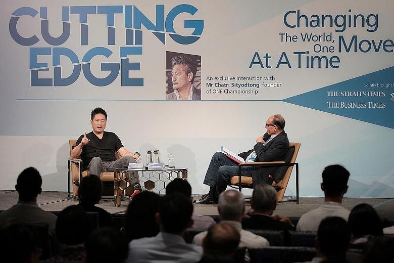 Mr Chatri Sityodtong (at left), founder of One Championship, at the Cutting Edge forum yesterday with Straits Times associate editor Vikram Khanna, who moderated the question-and-answer session. At the event, Mr Chatri shared lessons from his rags-to