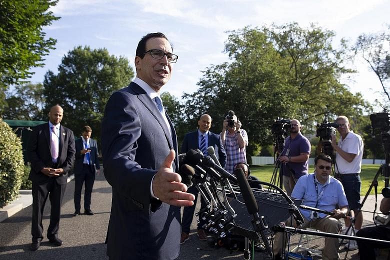 US Treasury Secretary Steven Mnuchin (centre) outside the White House. Mr Mnuchin and other Trump administration officials will visit Shanghai next week for trade talks with China. PHOTO: EPA-EFE