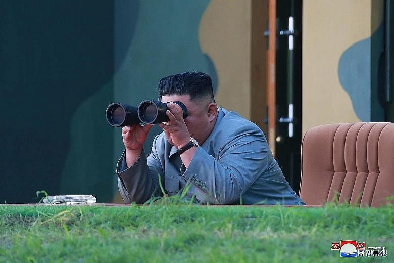 North Korean leader Kim Jong Un watching the test-firing of two short-range ballistic missiles on Thursday. This is the first test since Mr Kim met US President Donald Trump last month and agreed to revive denuclearisation talks.