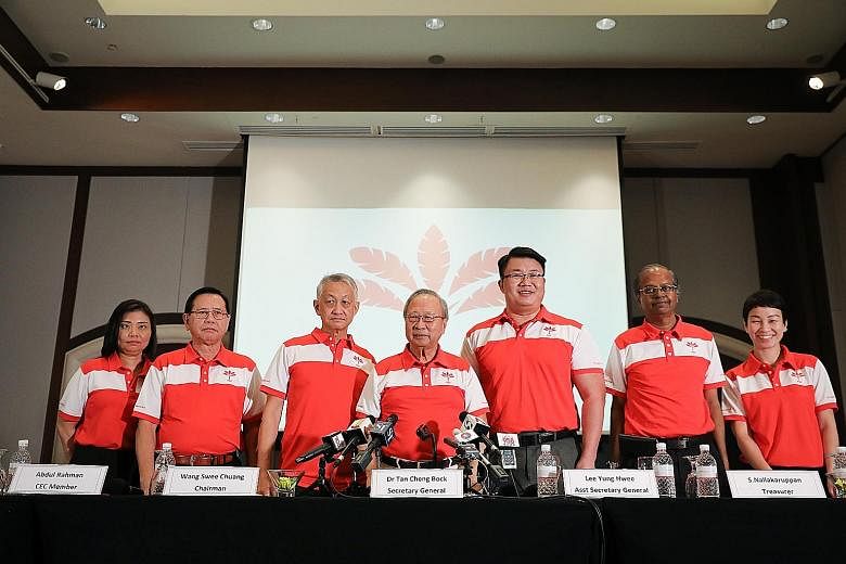 Progress Singapore Party secretary-general Tan Cheng Bock (centre) with (from left) assistant treasurer Hazel Poa, Central Executive Committee (CEC) member Abdul Rahman, chairman Wang Swee Chuang, assistant secretary-general Lee Yung Hwee, treasurer 