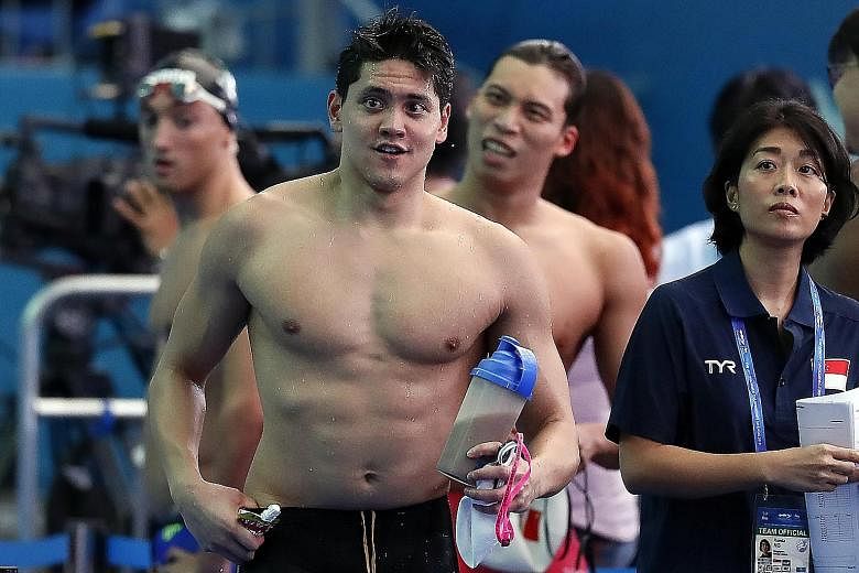 Joseph Schooling during the 100m butterfly heats at the Fina World Championships on Friday, where he clocked 52.93sec. He was ranked 24th and failed to qualify for the semi-finals. His agent and manager Ronda Ng Doswell (right) was with him at the ev