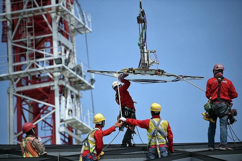 Singapore's workplace fatal injury rate has gone down over the years, from 4.9 per 100,000 workers in 2004 to 1.2 per 100,000 in the past two years. ST PHOTO: KUA CHEE SIONG
