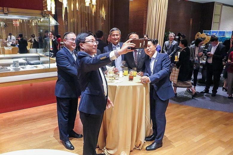 Foreign Minister Vivian Balakrishnan (centre in picture) arrived in Bangkok yesterday to attend the Asean Foreign Ministers' Meeting and related discussions like the East Asia Summit and Asean Regional Forum. The annual Asean Foreign Ministers' Meeti