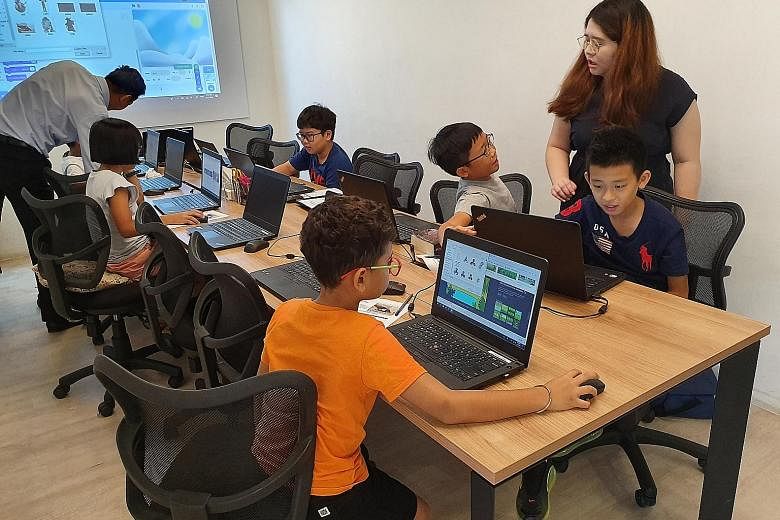 Children as young as seven learning to code using visual programming language Scratch at Coding Lab.