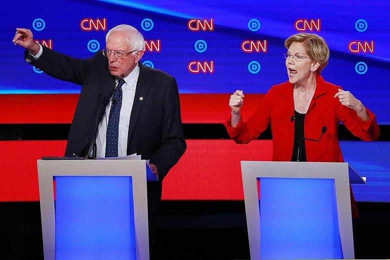 United States senators Bernie Sanders and Elizabeth Warren had vowed not to attack each other at Tuesday's debate, but often found themselves teaming up to defend policy positions they share instead of drawing contrasts. PHOTO: REUTERS