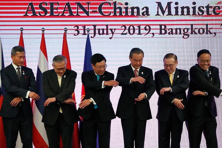 From far left: Singapore's Foreign Minister Vivian Balakrishnan, Thailand's Minister of Foreign Affairs Don Pramudwinai, Vietnam's Foreign Minister Pham Binh Minh, China's Foreign Minister Wang Yi, Philippine Secretary of Foreign Affairs Teodoro Locs