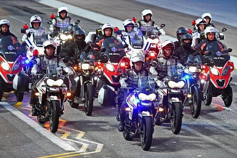 First Sergeant Soh Jia Yu leading the 21-bike contingent, which consists of riders from the Singapore Armed Forces, Traffic Police, Rapid Deployment Troops under the police, and the Singapore Civil Defence Force, during a preview of the National Day 