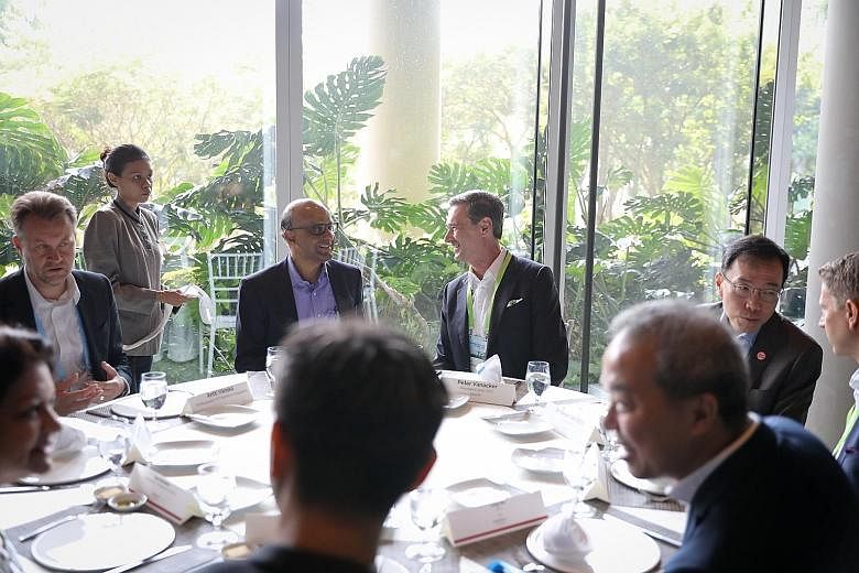 (From left) Finland's Ambassador to Singapore Antti Vanska, Senior Minister and Coordinating Minister for Social Policies Tharman Shanmugaratnam, Neste president and chief executive Peter Vanacker and Economic Development Board chairman Beh Swan Gin 