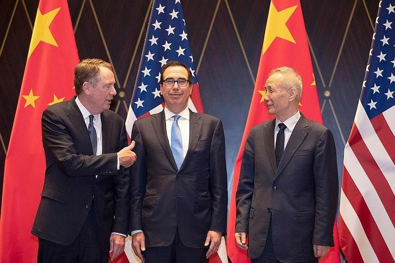 (From far left) US Trade Representative Robert Lighthizer, US Treasury Secretary Steven Mnuchin and Chinese Vice-Premier Liu He at the Xijiao Conference Centre in Shanghai yesterday. PHOTO: AGENCE FRANCE-PRESSE