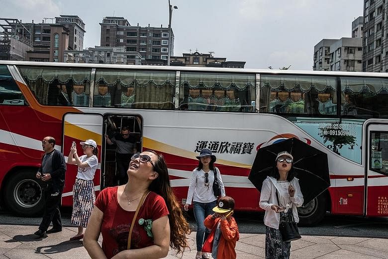 Chinese tourists in Taipei. In a blow to Taiwan's tourism sector, China said it would stop issuing individual permits to Chinese visitors to the island starting yesterday, citing the state of ties with what it considers a wayward province.