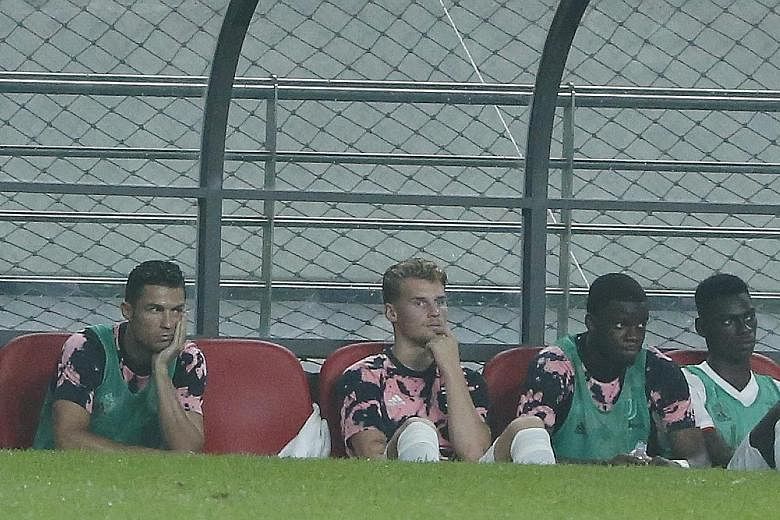 Juventus' Cristiano Ronaldo (far left) on the bench during the pre-season friendly match against a K-League all-star team at the Seoul World Cup Stadium in Seoul last week. The club have said that he did not feature owing to medical reasons, having p