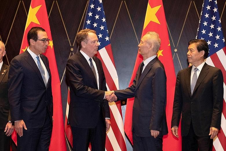(From left) US Treasury Secretary Steven Mnuchin, US Trade Representative Robert Lighthizer, Chinese Vice-Premier Liu He and Chinese Commerce Minister Zhong Shan at trade talks in Shanghai on Wednesday. PHOTO: REUTERS