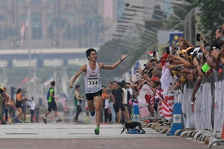Singapore marathoner Soh Rui Yong sprinting to victory as he crosses the finish line in Putrajaya at the 2017 SEA Games to retain his title. ST FILE PHOTO