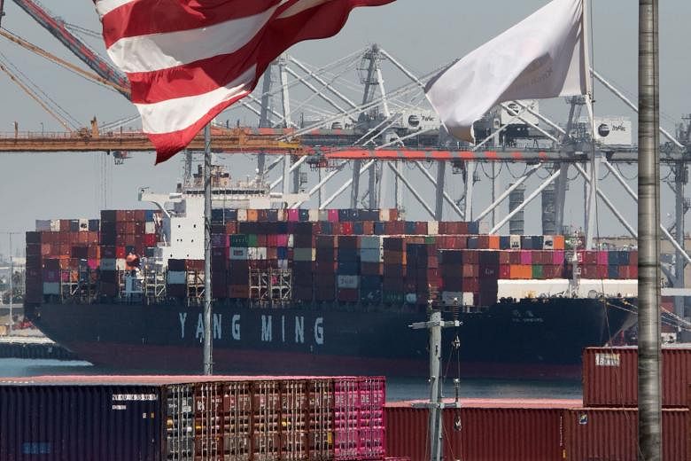 A container ship unloading its cargo from Asia at the Port of Long Beach, in California, on Thursday. With the next round of trade talks to be held next month in the US, Washington is essentially giving China one month to come up with concessions. Th