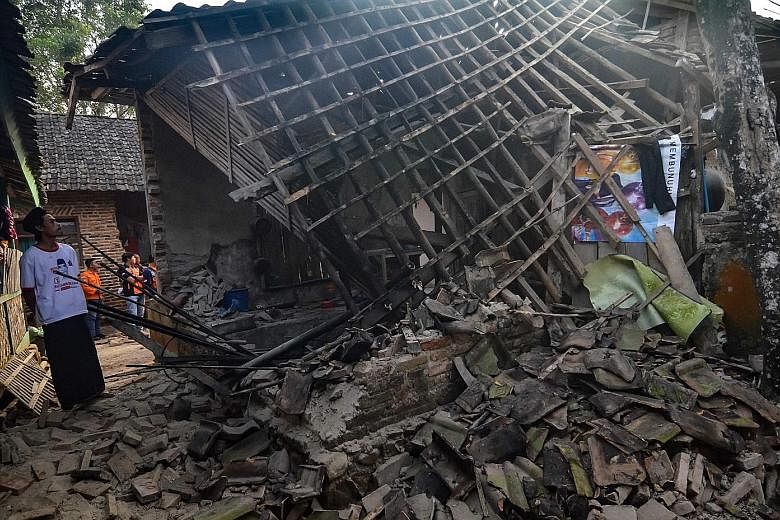 Another house in Pandeglang (below) that was damaged by the quake. At least 223 houses were destroyed.