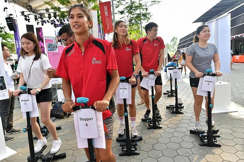 Singapore athletes (from left) Sasha Christian (wakeboard), Michelle Sng (high jump) and Christopher Cheong (swimming) all lost loved ones to cancer. Through the stair-climbing activity yesterday, they were helping to raise awareness of adolescents a