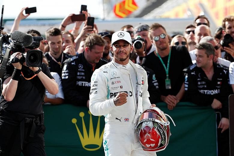 Mercedes' Lewis Hamilton celebrates winning the Hungarian Grand Prix with his team. With Mercedes teammate Valtteri Bottas managing only eighth place, his lead has grown to a massive 62 points. 