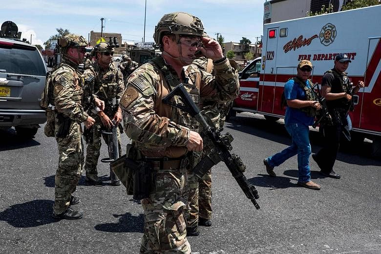 Shoppers leaving the store after the mass shooting in El Paso. The victims included children and the elderly. PHOTO: REUTERS A screengrab from security footage shows the gunman entering the Walmart store in El Paso, Texas, on Saturday. PHOTO: AGENCE 