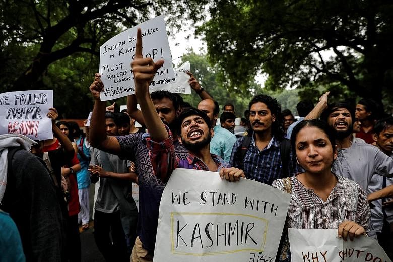 People protesting in New Delhi yesterday after the Indian government scrapped the special status for Kashmir.