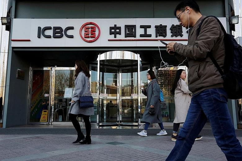 Analysts predict that more of China's roughly 4,000 small lenders will run into trouble and that bigger banks, such as Industrial and Commercial Bank of China (above), will be asked to shore them up. While regulators could allow distressed lenders to