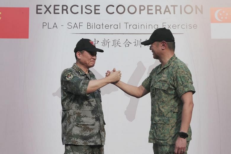 Lieutenant-General Zhang Jian (left), Commander of the Southern Theatre Command Army of the People's Liberation Army, with Brigadier-General Kenneth Liow, the Singapore Armed Forces' Chief of Staff for General Staff.