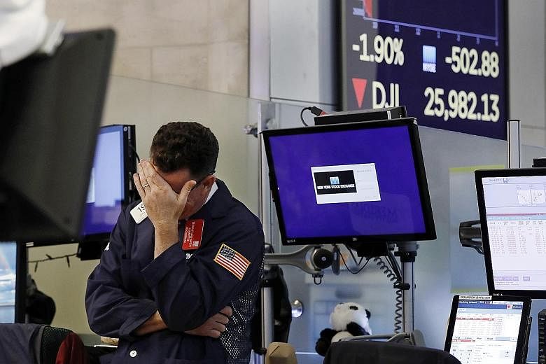 A trader at the New York Stock Exchange reacting on Monday as the Dow Jones plunged. The chances of a trade deal being reached before the US election next year look slim, said one analyst.