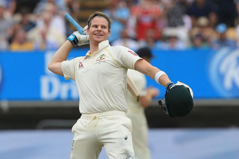 Australia's Steve Smith celebrates reaching a century on the fourth day of the first Ashes Test match against England at Edgbaston on Sunday.