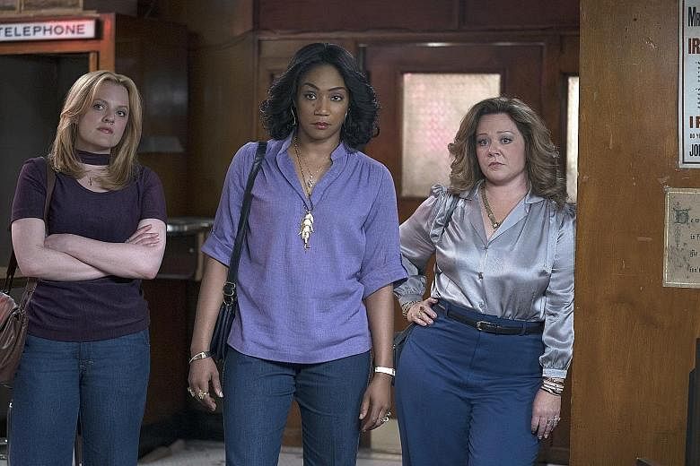 In The Kitchen, (from left) Elisabeth Moss, Tiffany Haddish and Melissa McCarthy play wives who come to enjoy having criminal lifestyles and being in charge.