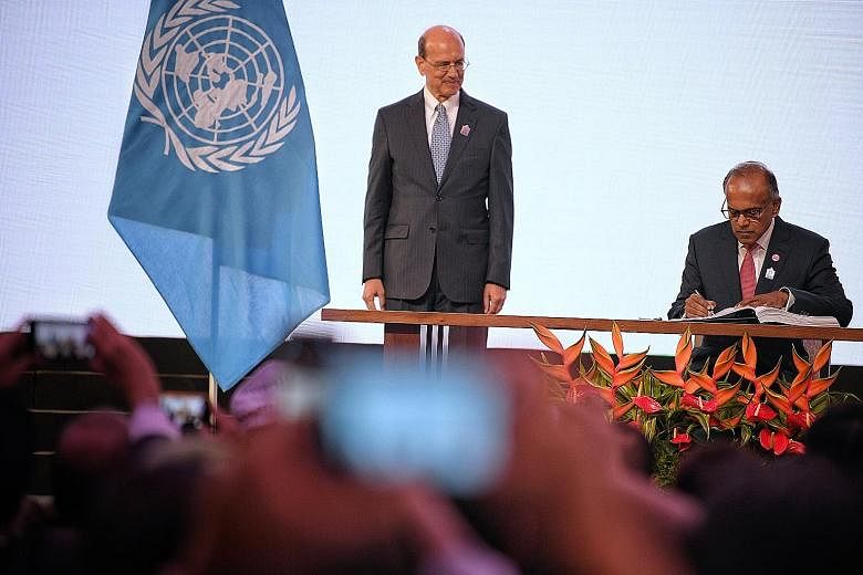 Law and Home Affairs Minister K. Shanmugam with UN Assistant Secretary-General for Legal Affairs Stephen Mathias during the Singapore Convention on Mediation signing ceremony yesterday.