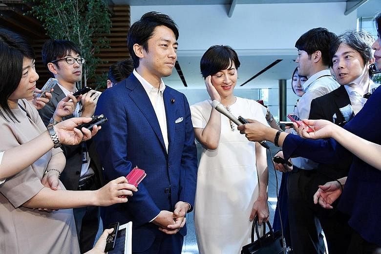 Mr Shinjiro Koizumi and Ms Christel Takigawa at their wedding announcement in Tokyo yesterday. Mr Koizumi is the son of Japan's former leader Junichiro Koizumi, while Ms Takigawa is a French-Japanese TV personality known as the face of Tokyo's succes