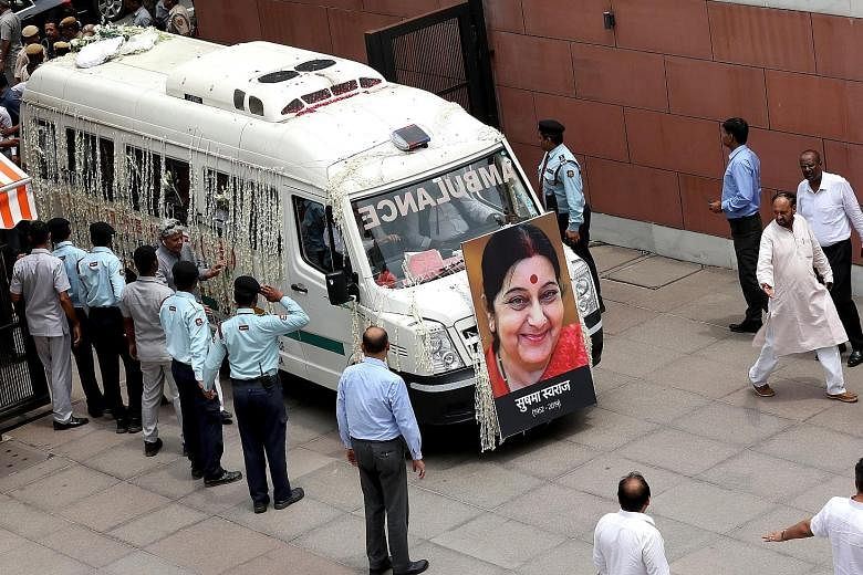 A vehicle carrying the body of former Indian external affairs minister Sushma Swaraj arriving at the headquarters of the ruling Bharatiya Janata Party in New Delhi yesterday.
