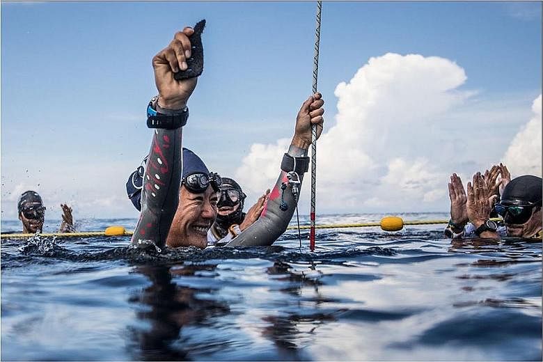 Freediver Lim Anqi (above) competing in the recent Caribbean Cup in Honduras (right). She came third in the constant weight no fins discipline, diving to a depth of 47m and breaking her previous 45m record.