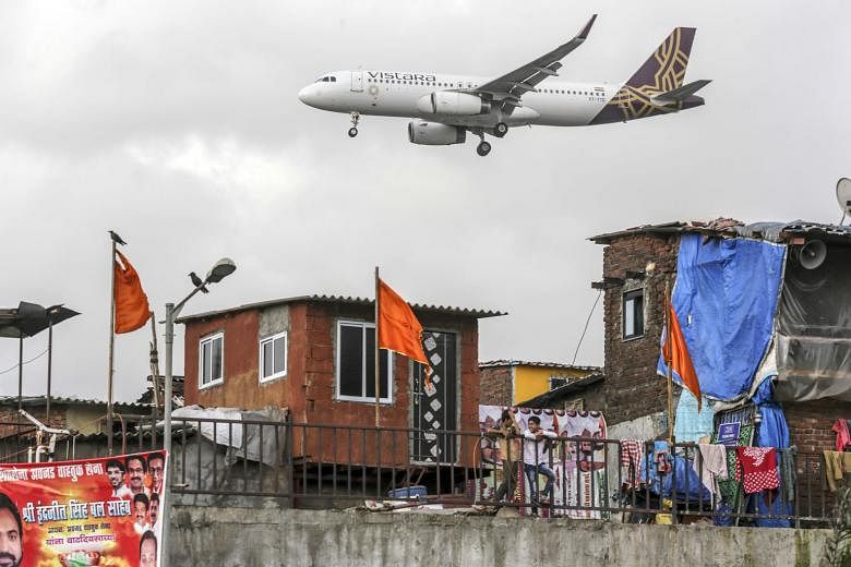 A Vistara aircraft preparing to land in Mumbai in a 2017 file photo. Vistara, which is 49 per cent owned by Singapore Airlines and 51 per cent by Tata Group, launched its first overseas service between New Delhi and Singapore on Tuesday. The carrier 