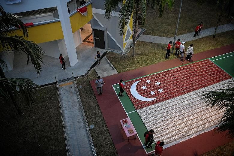 A display of the nation's flag created from 18,000 eggs near Block 686 Hougang Street 61 yesterday, at a Sengkang South community celebration that was attended by Prime Minister Lee Hsien Loong. ST PHOTO: MARK CHEONG