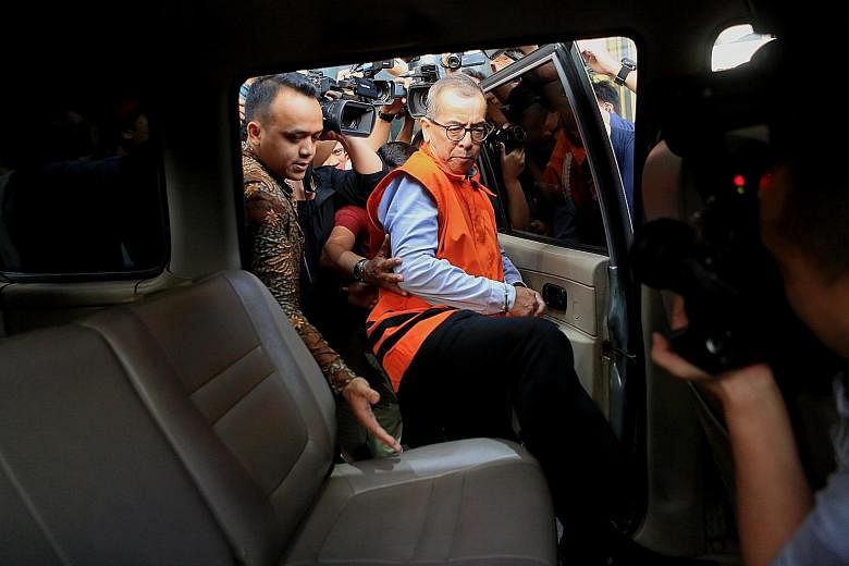 Former Garuda airline chief Emirsyah Satar being taken away after being questioned at the Corruption Eradication Commission on Wednesday in Jakarta. He has been arrested and detained over money-laundering and bribery allegations. PHOTO: THE JAKARTA P