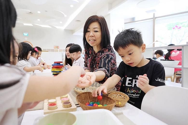 PayNow makes it convenient for parents, said Ms Wendy Tan (foreground), co-founder of Josiah, seen here at the group's Suntec City centre with principal Germaine Kok. ST PHOTO: GAVIN FOO