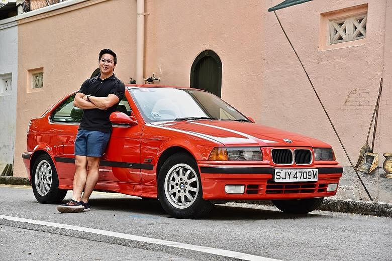 Mr Joseph Goh and his 22-year-old BMW 316i Compact, which he says he enjoys driving more than his parents' two BMWs at home. He estimates he may have spent about $20,000 over the past eight years to keep it running well.