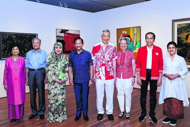 (Second row, from left) Indonesia's First Lady Iriana Widodo and President Joko Widodo, Brunei's Queen Raja Isteri Pengiran Anak Hajah Saleha and Sultan Hassanal Bolkiah, and Malaysia's First Lady Siti Hasmah Mohamad Ali and Prime Minister Mahathir M