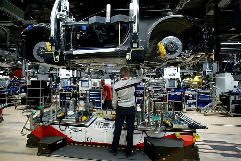 A sports car being assembled at a Porsche factory in Stuttgart-Zuffenhausen, Germany. The United States is the largest export market for the German car industry. Porsche, in particular, is dependent on the US market. It sells every fourth vehicle in 