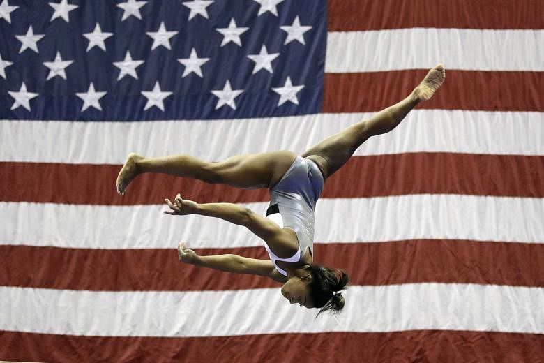 Simone Biles working on the balance beam during practice for the American gymnastics championships on Wednesday in Kansas City. PHOTO: ASSOCIATED PRESS