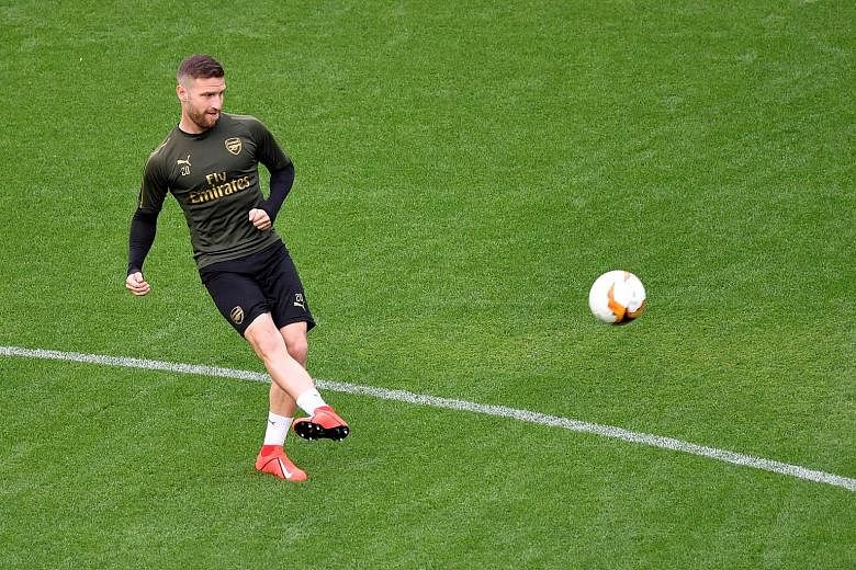 Shkodran Mustafi's (left) future at the Emirates has been thrown into doubt with Arsenal's capture of David Luiz, a direct competitor to the German's position at the heart of defence. PHOTO: AGENCE FRANCE-PRESSE