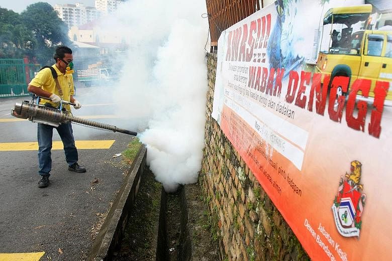 Fogging being carried out in Kuala Lumpur. There were 251 dengue hot spots in nine states in Malaysia, and most cases were in urban areas. PHOTO: THE STAR/ASIA NEWS NETWORK