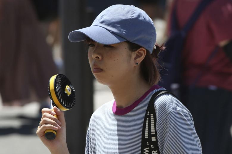 Portable fans a breath of fresh air in Japan's sweltering summer heat