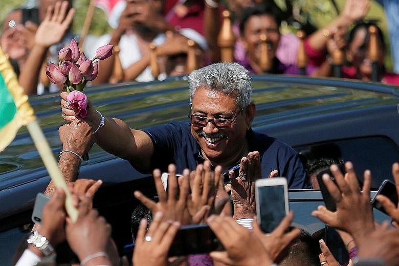 Sri Lanka's former defence secretary Gotabaya Rajapaksa waving to supporters. He is facing lawsuits in the US for allegedly instigating and authorising the extrajudicial killing of a journalist and war crimes against Tamils.
