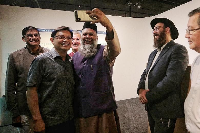 Deputy Prime Minister Heng Swee Keat (second from left) with representatives of different faiths - (from left) Mr P. Sivaraman, Reverend Gabriel Liew, Mr Mohd Rafeeq Mohd Yussof, Rabbi Netanel Rivni and Monsignor Philip Heng - at the launch of Temase