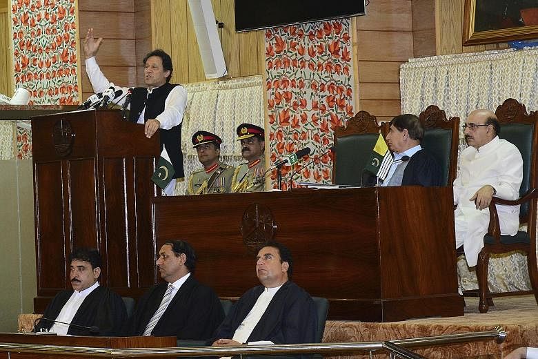 Prime Minister Imran Khan addressing Pakistan-administered Kashmir's Legislative Assembly in Muzaffarabad on Pakistan's Independence Day yesterday. PHOTO: ASSOCIATED PRESS