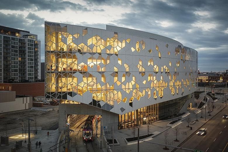 The Calgary New Central Library in Canada has train tracks running through it.