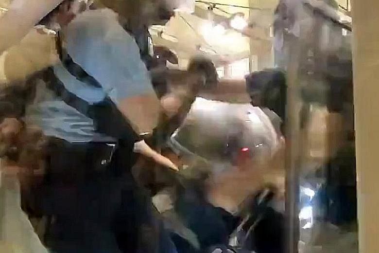 A video of a Hong Kong police officer pulling his gun on protesters after they surrounded him, took his baton and beat him with it, has gone viral on Twitter. The video, filmed by Wall Street Journal reporter Mike Bird and posted on his Twitter accou